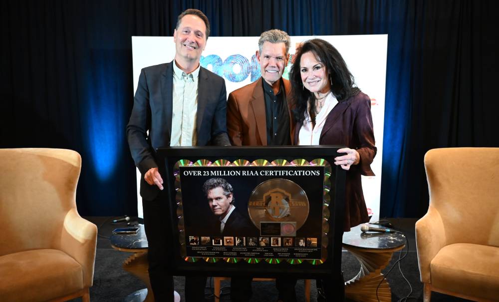 Randy Travis Receives Career Plaque From RIAA Celebrating 23 Million Certified Units